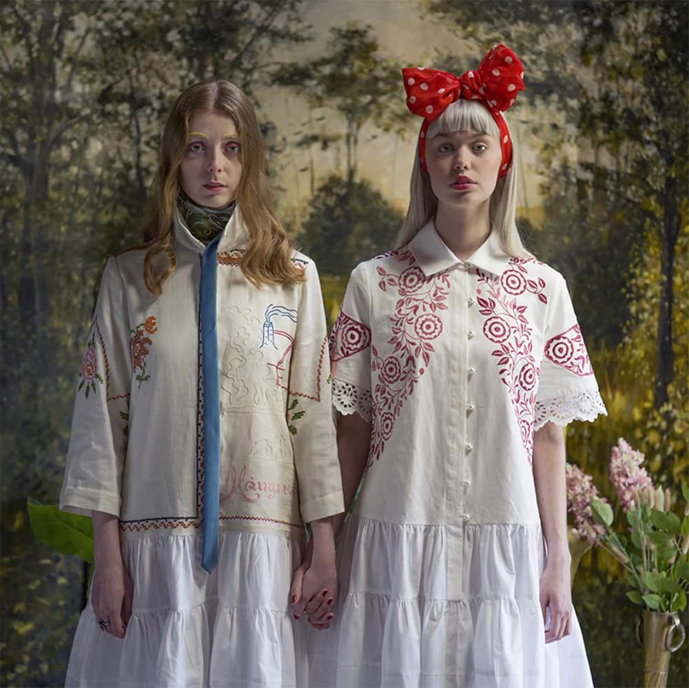 JF Peace design at Green Little Heart, a girl in an arty green forest environment with remade dresses.