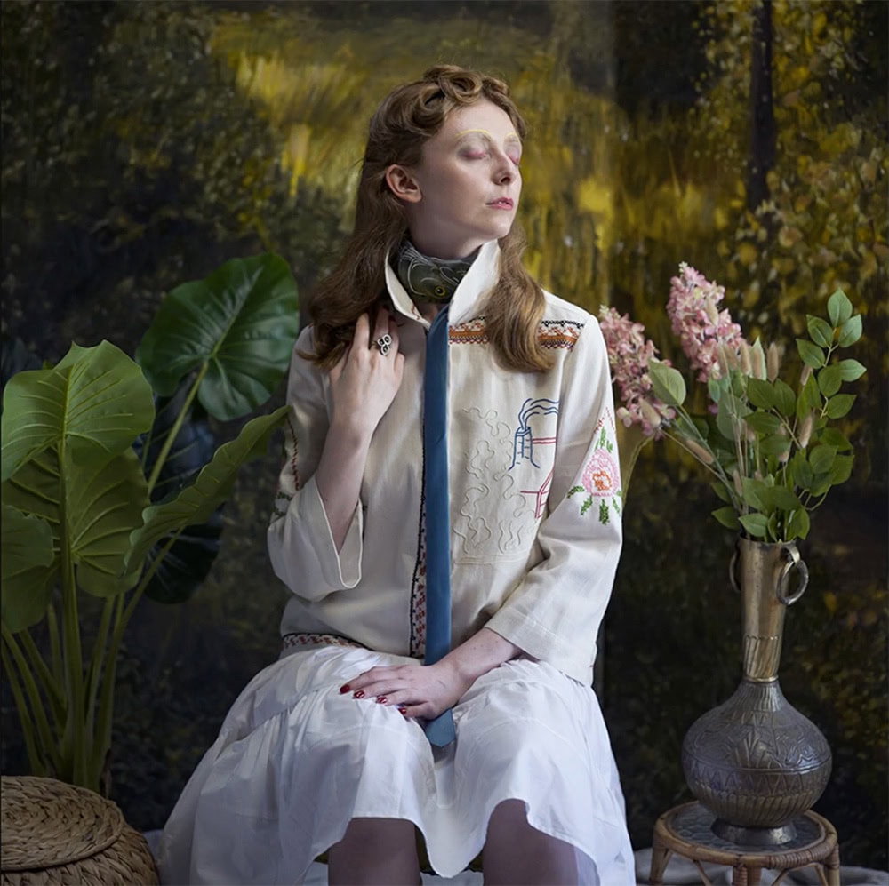 JF Peace design at Green Little Heart, a girl in an arty green forest environment with a remade dress.